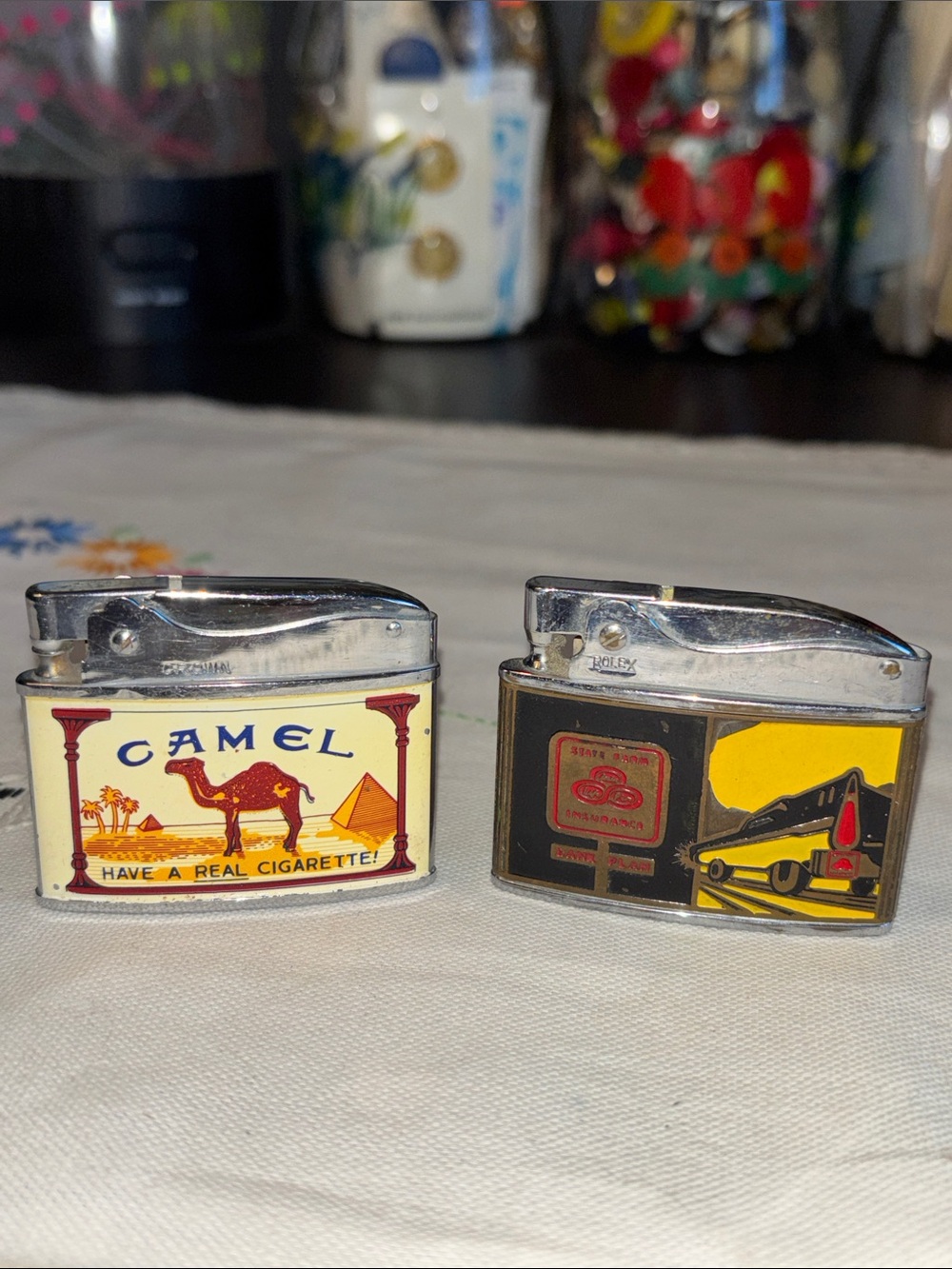 EUC VINTAGE ROLEX AND  CROWN pocket lighter 1950s featuring a State Farm Ins